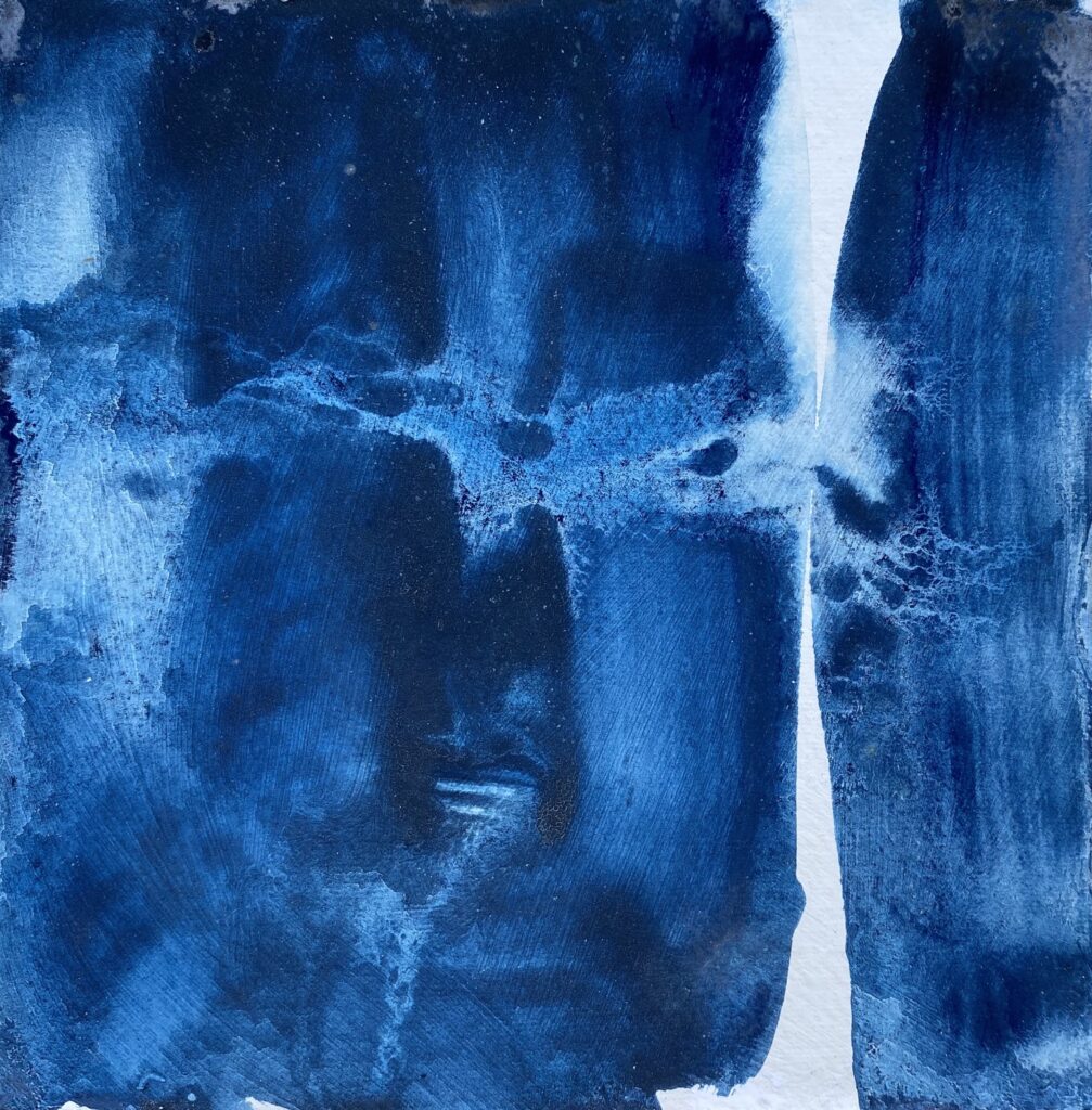 abstract blue ink drawing with a cloud like form crossing two areas, one to the left and the right. The middle is white, and the dark areas suggest other things like stairs and caves and mirrors.